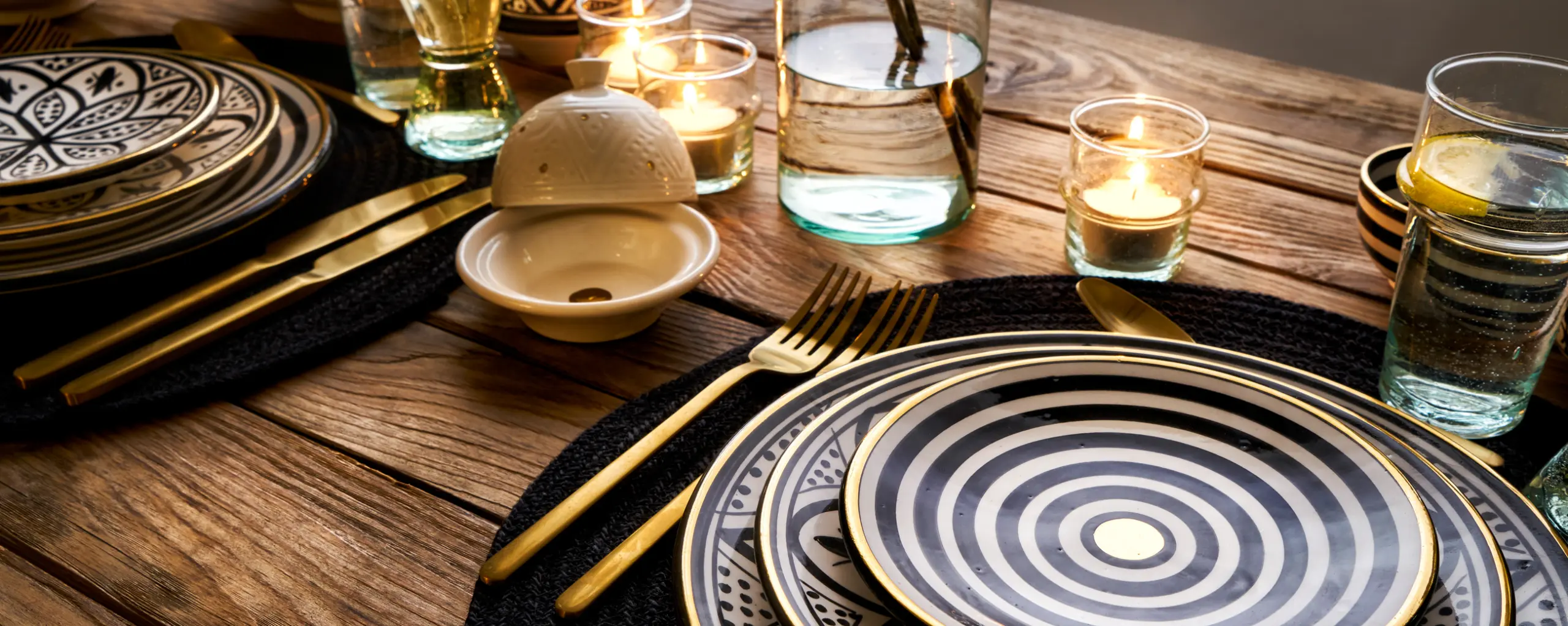 tabletop photography of plates and decoration, glasses and cutlery