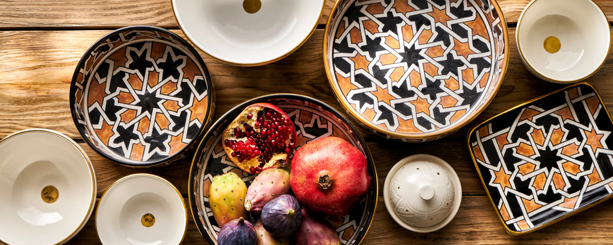 tabletop photography of plates and decoration, glasses and cutlery