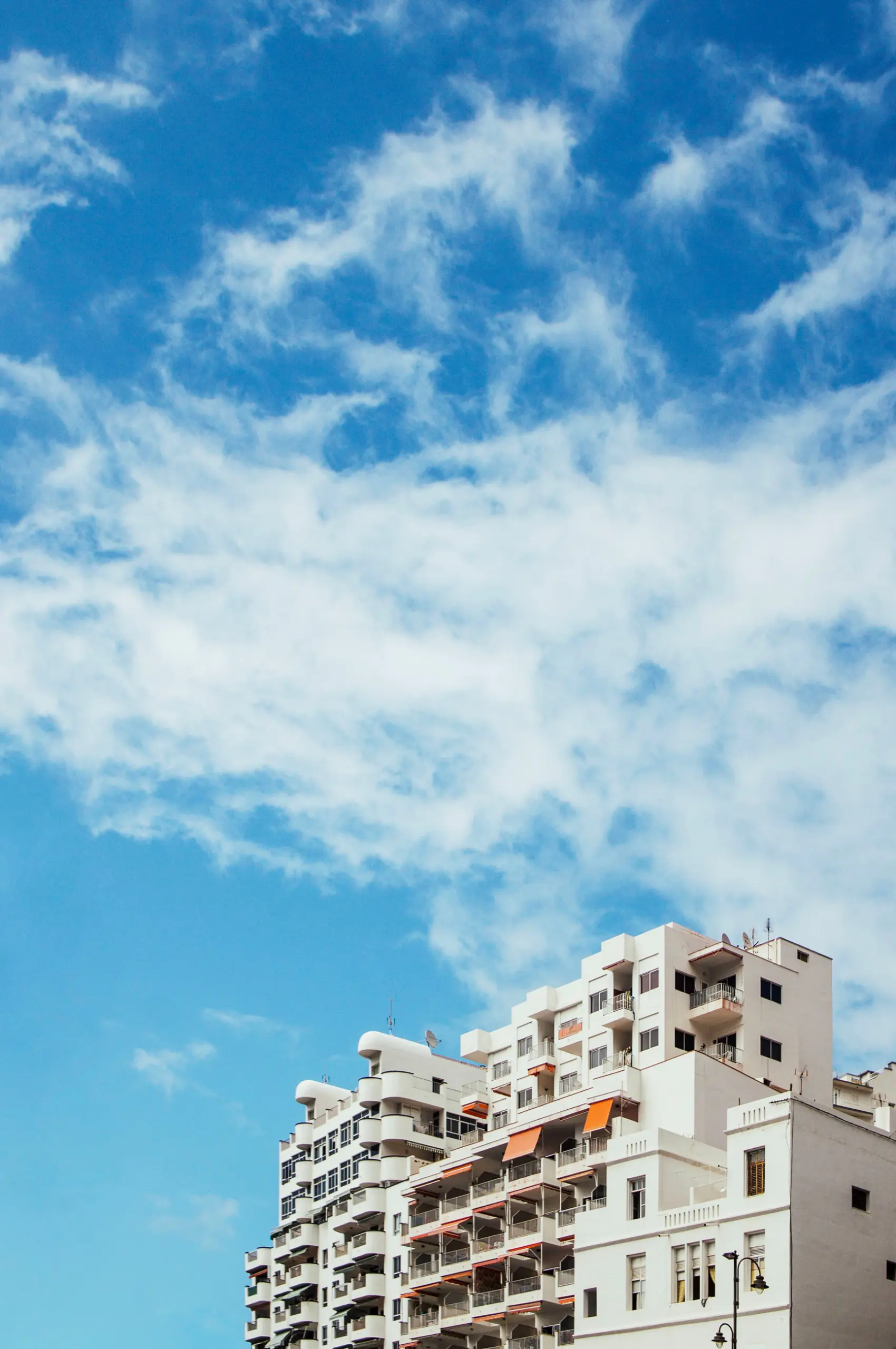 achritecture photo of buildings in front of blue sky